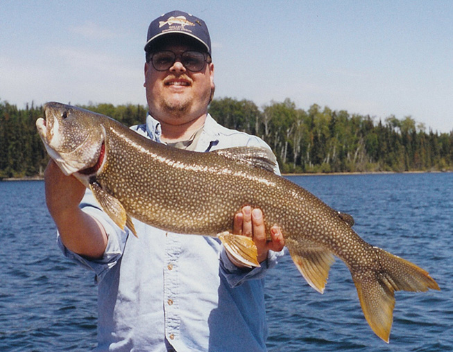 This is a photo of a man holding a 10 pound Lake Trout
