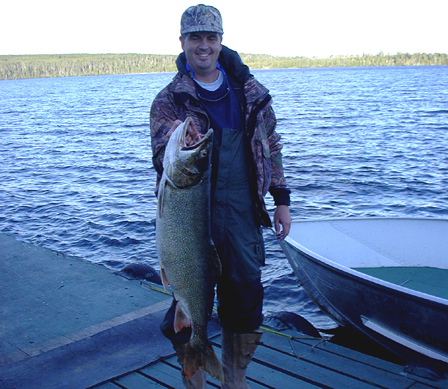 This is a photo of a man holding a 25 pound Lake Trout