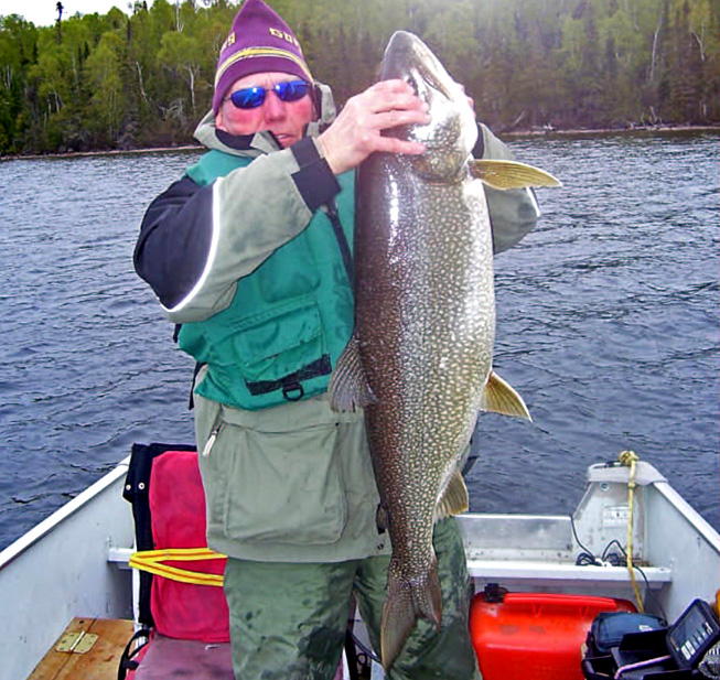 This is a photo of a man holding a 35 pound Lake Trout